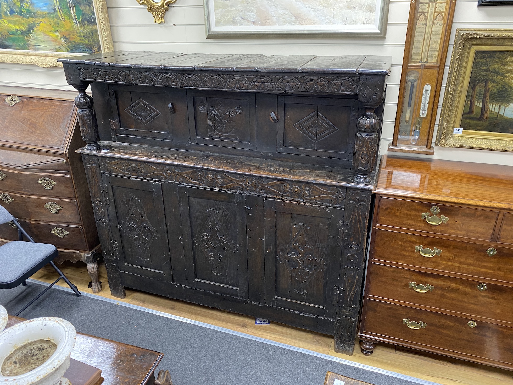 An 18th century oak court cupboard, width 173cm, depth 53cm, height 159cm